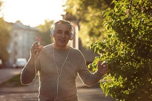 Man with hearing loss using headphones